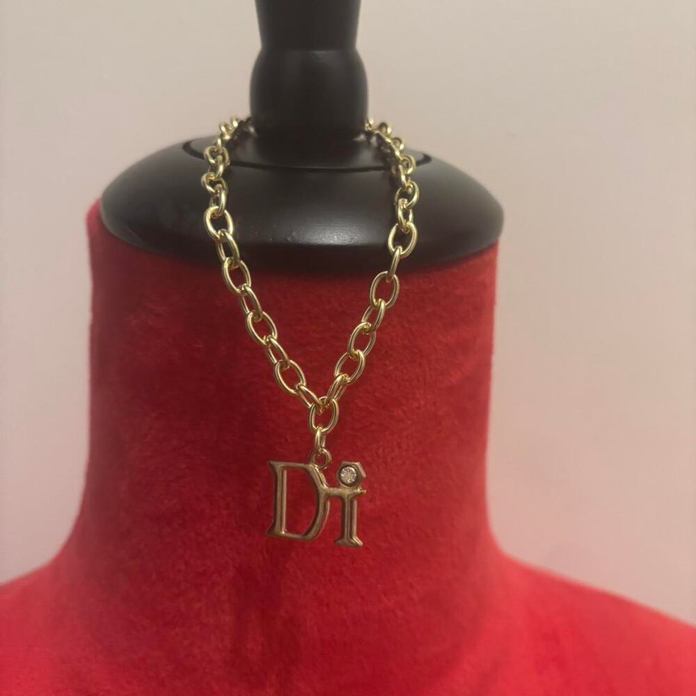 Gold tone diamond international charm